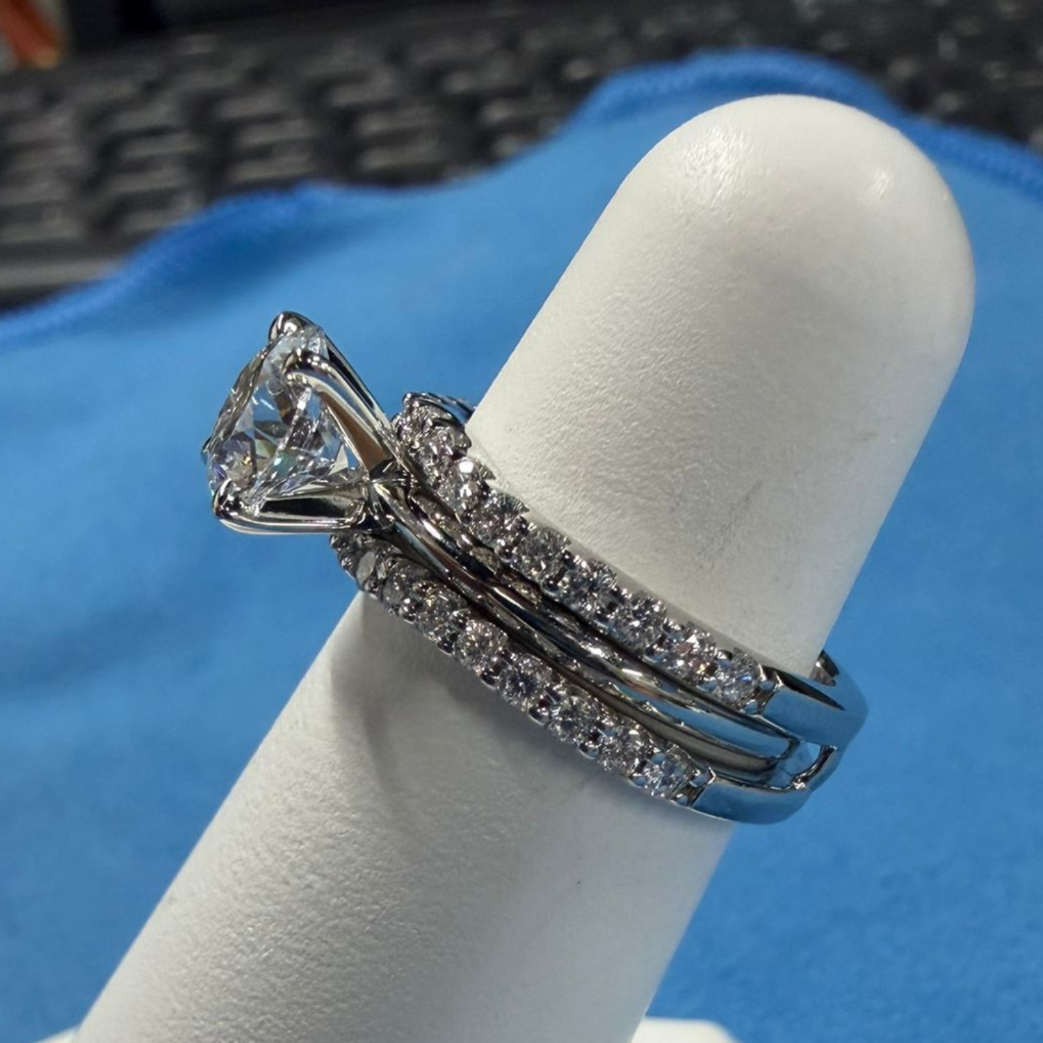 Finished product of custom double wrapped wedding band with 1 carat lab diamond engagement ring