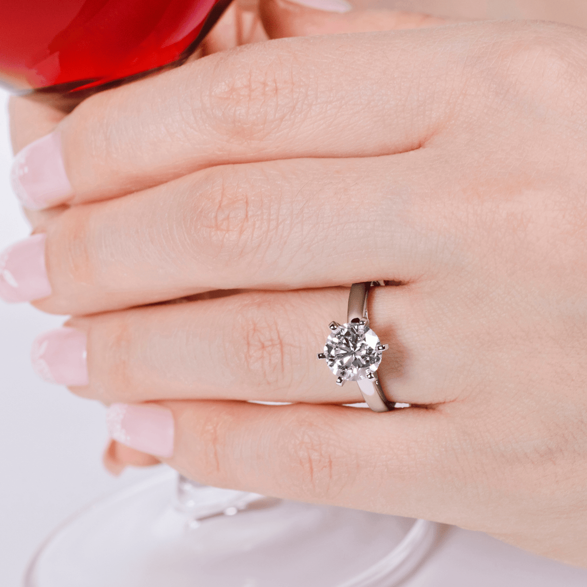 2 carat solitaire lab-grown diamond engagement ring in 14K gold against red background — sizes $4, 4.5, 5, 5.5, 6, 6.5, 7, 7.5, 8, 8.5, 9, 9.5, 10$